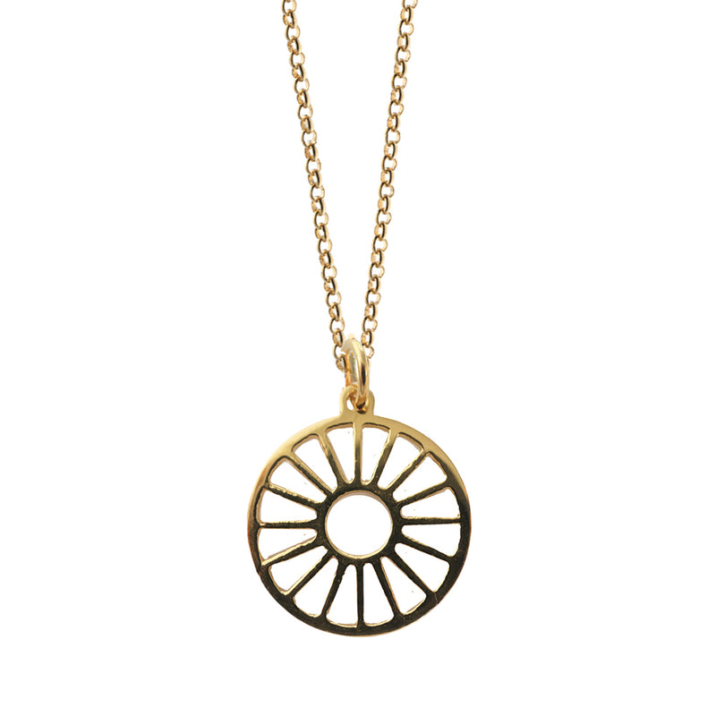 Gold necklace with a circular pendant on a white background